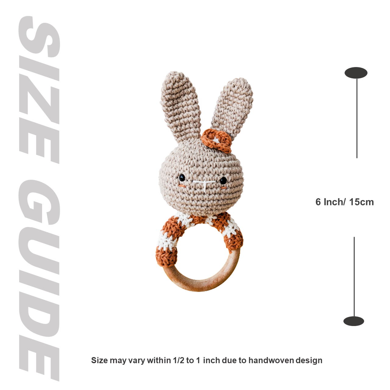 Crocheted bunny rattle with wooden ring and size guide on a white background