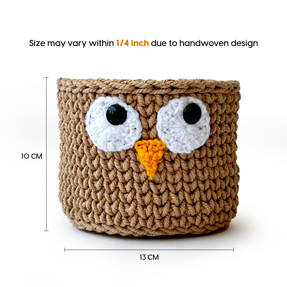 Crocheted owl-shaped basket with measurements on a white background