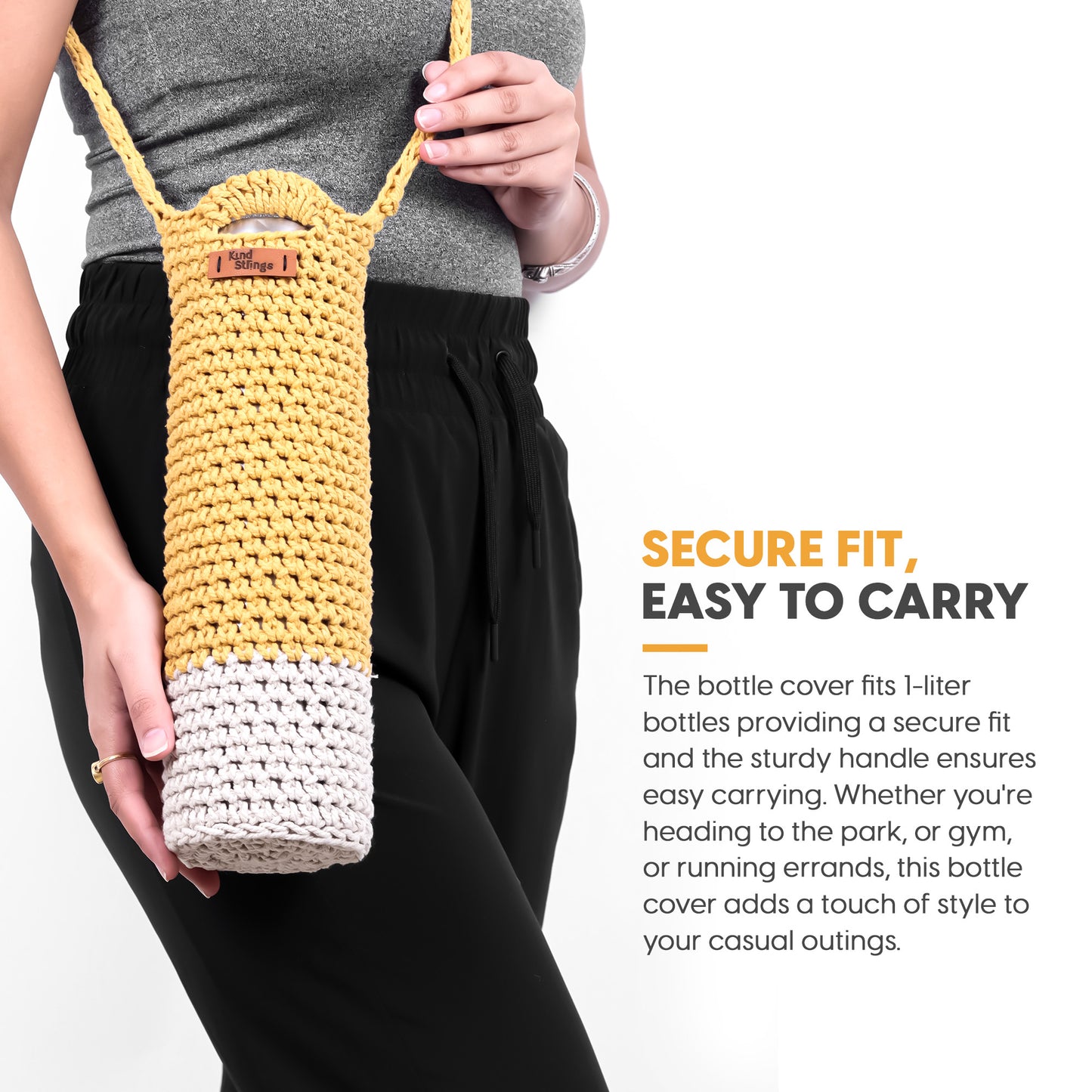 Person holding a yellow and white bottle cover with text about its features.