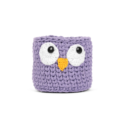 Purple crocheted owl-shaped container on a white background