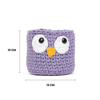 Purple knitted owl-shaped container with measurements on a white background