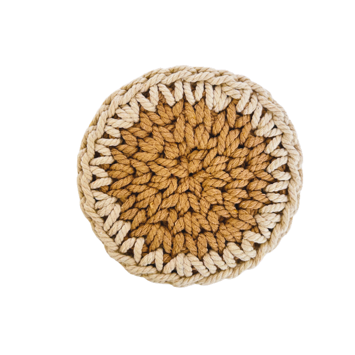 Round crocheted trivet with a gradient of brown and beige on a white background