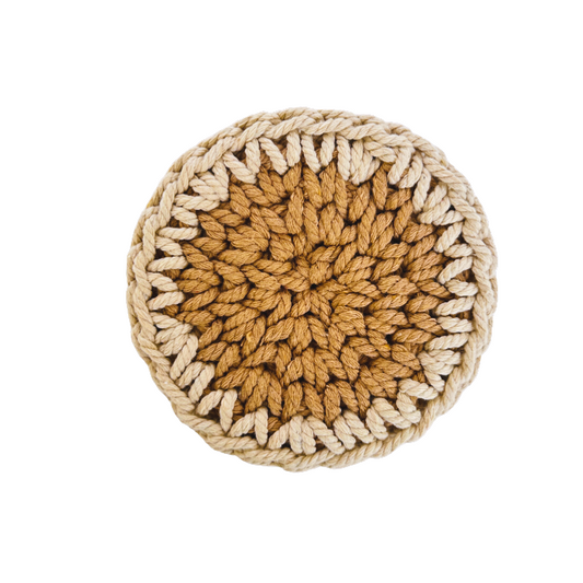 Round crocheted trivet with a gradient of brown and beige on a white background
