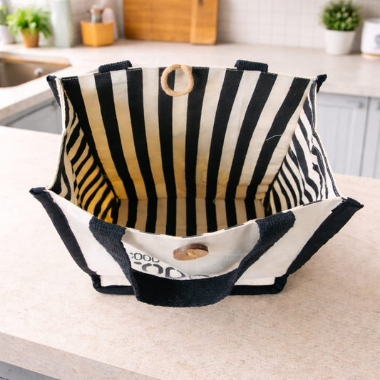 Black and white striped ood bag on a kitchen counter