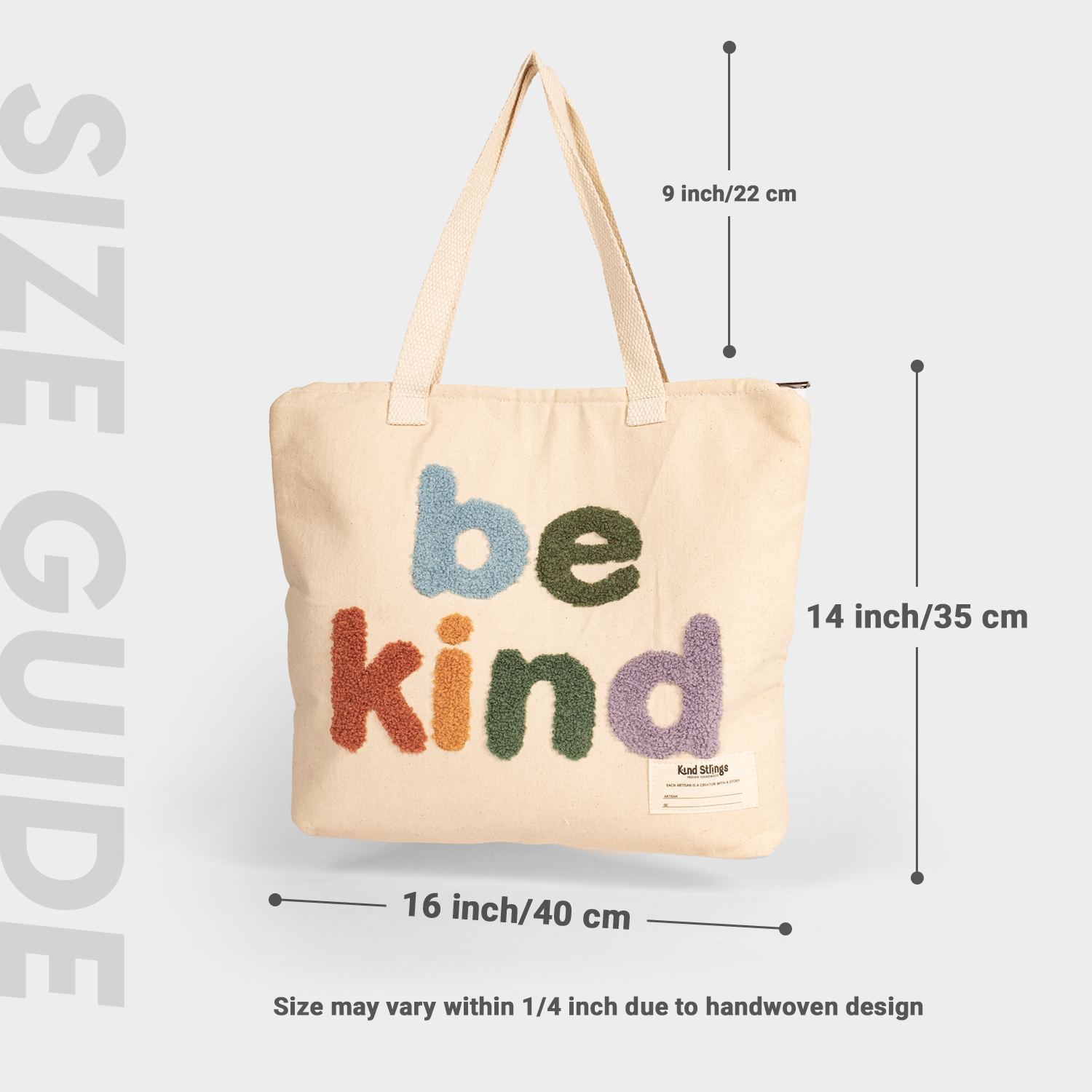 White  tote bag with 'be kind' text and measurements on a light gray background