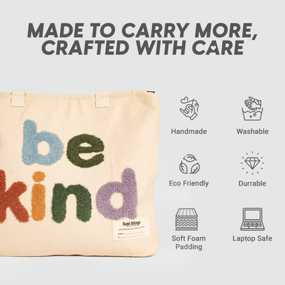 White tote bag with 'be kind' text, displayed with product features on a light gray background.