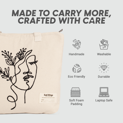 White tote bag with black line art design and text on a light gray background.