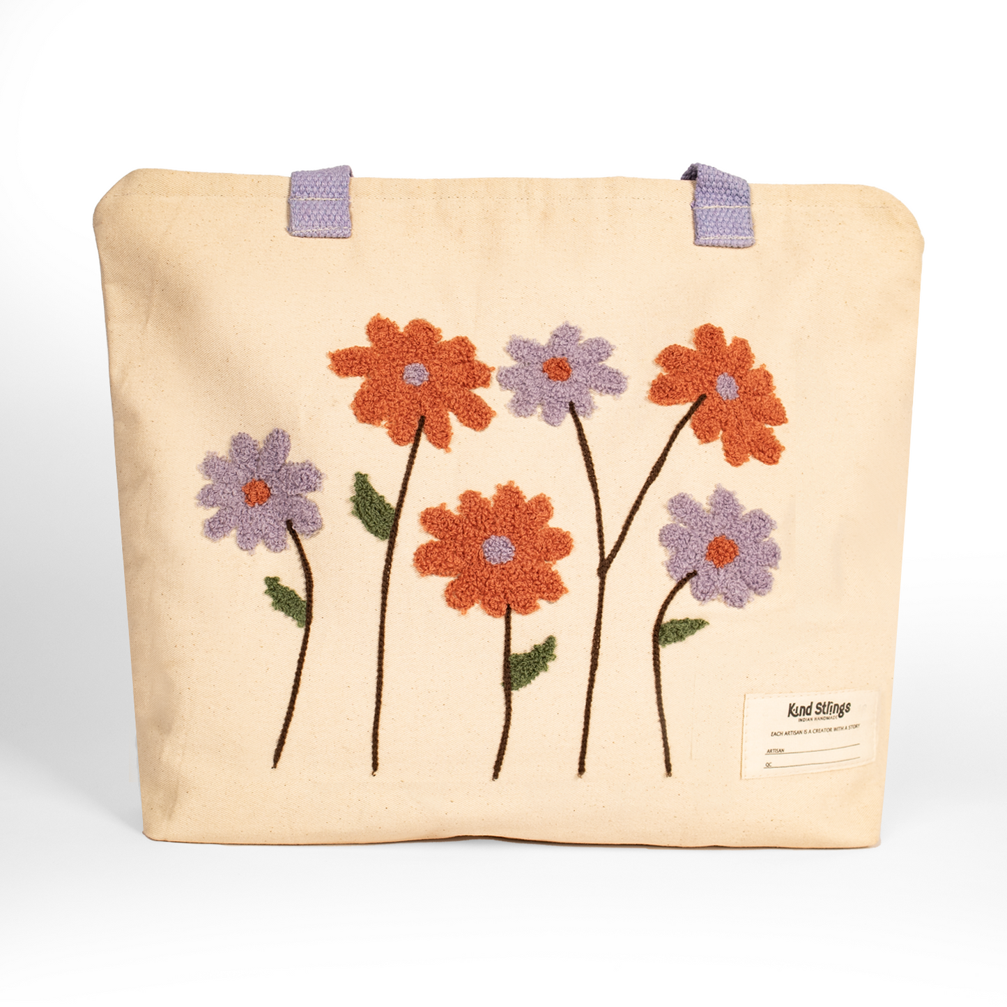 White tote bag with embroidered flowers on a white background