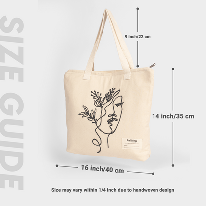 White tote bag with floral design and size measurement details on a light gray background