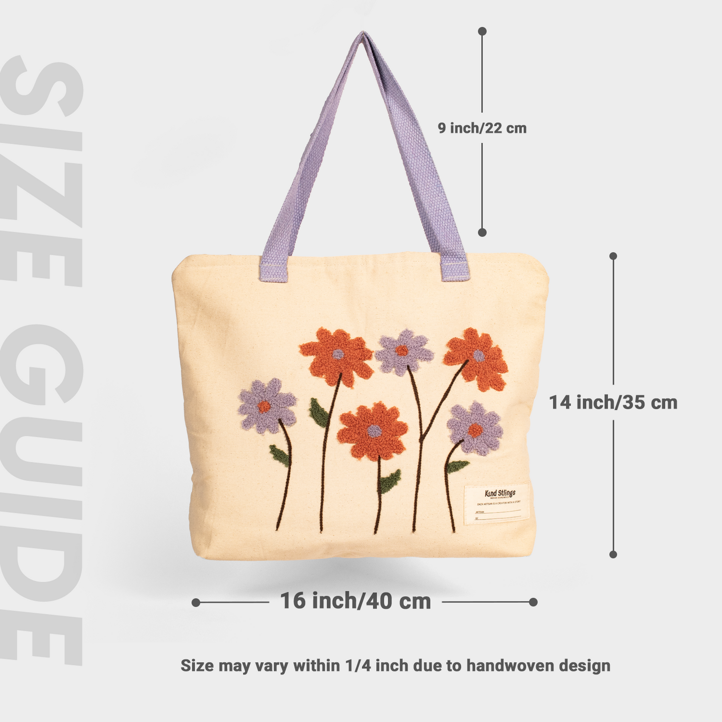 Whie tote bag with floral designs and measurements on a light gray background